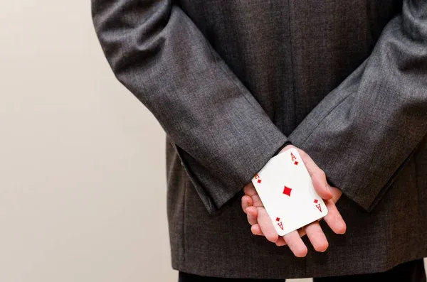 depositphotos_135867562-stock-photo-businessamen-with-aces-in-the